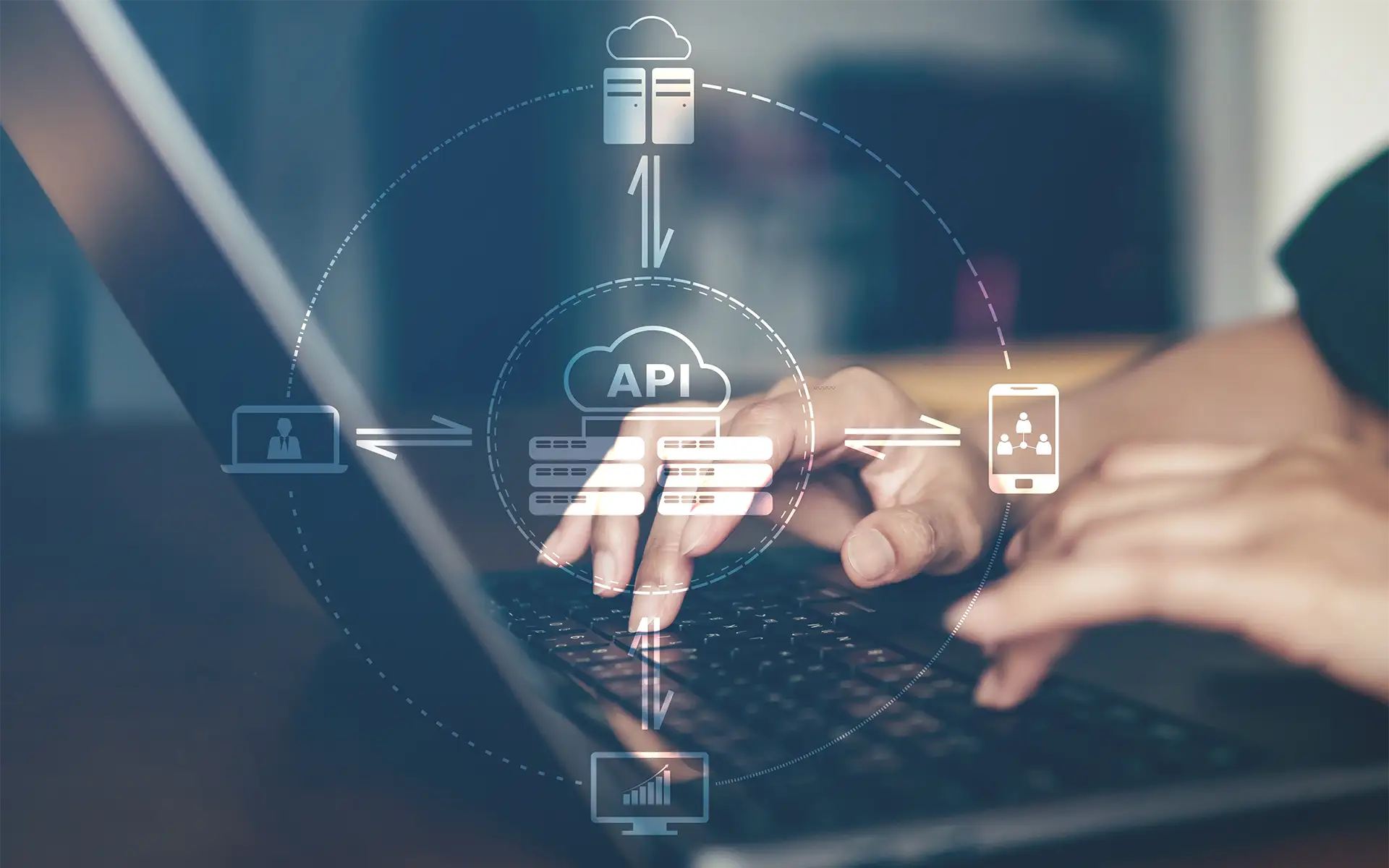 A person on a laptop interacting with 3D icons representing data auotmation through API Integration